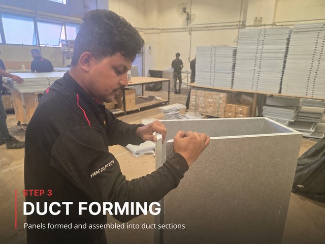 Step 3, duct forming: a fabricator folding a grooved PIR panel up into a rectangular duct section.