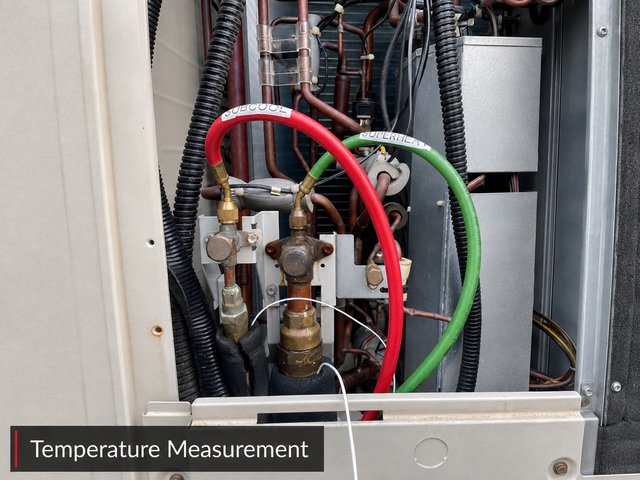 Sensor leads labelled SUBCOOL and SUPERHEAT connected to the liquid and gas service valves of a VRF outdoor unit.