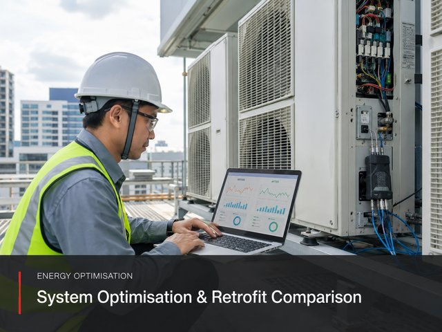 An engineer with a laptop showing before-and-after performance charts, measurement leads run into the VRF unit beside them.