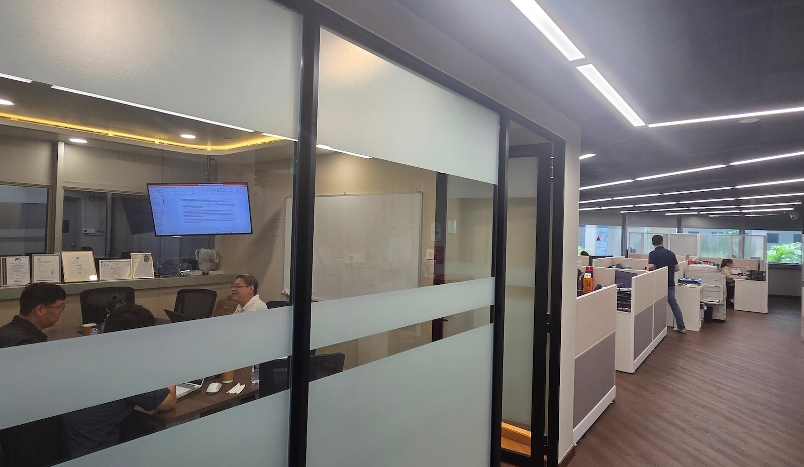 The YITAC office in Woodlands: engineers and project staff at work across an open-plan floor.